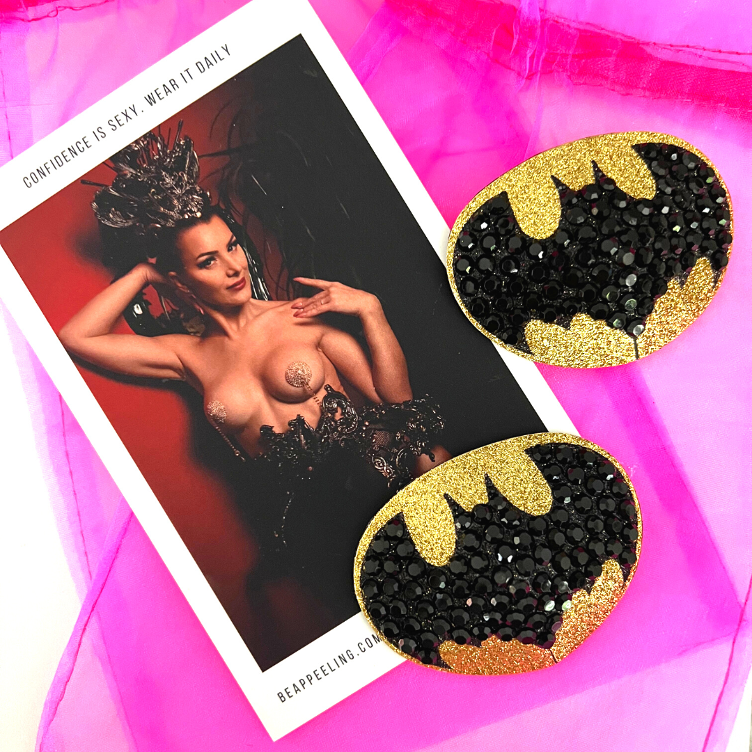 BAT SIGNAL Cache-tétons ovales dorés et noirs en forme de chauve-souris (2 pièces) pour les festivals de lingerie burlesque et Halloween